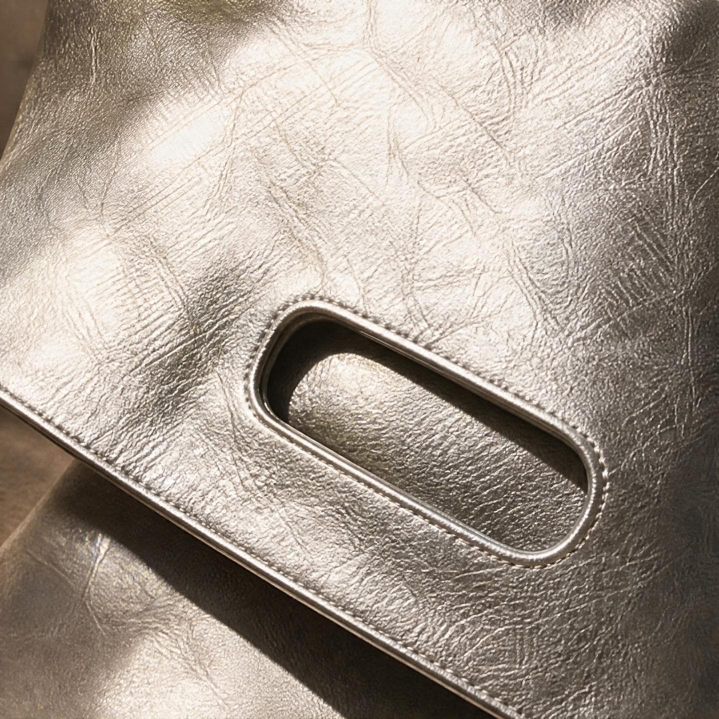 Extreme close-up of the crinkled texture and moulded handle cutout